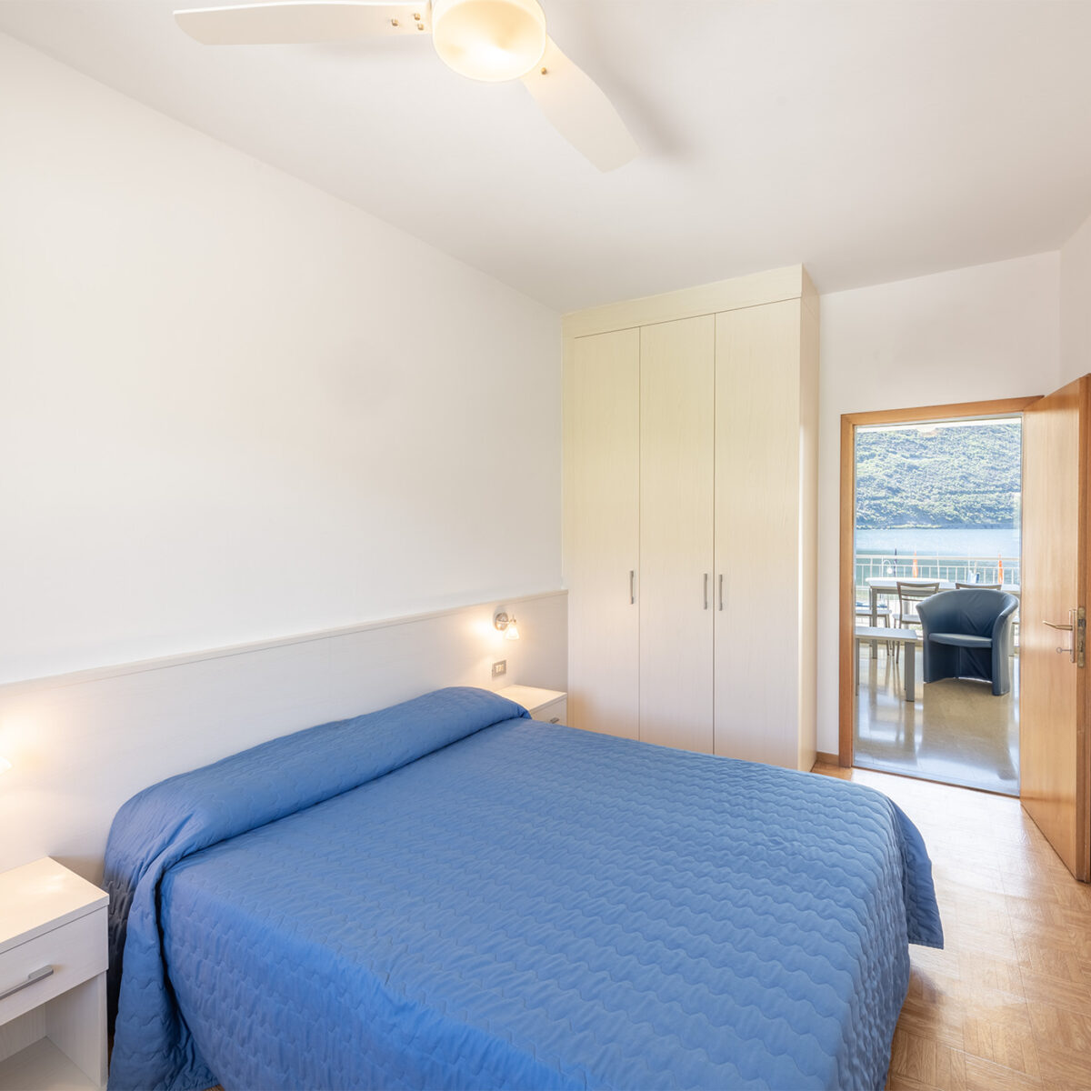 The bedroom has a spacious double bed and ample wardrobes