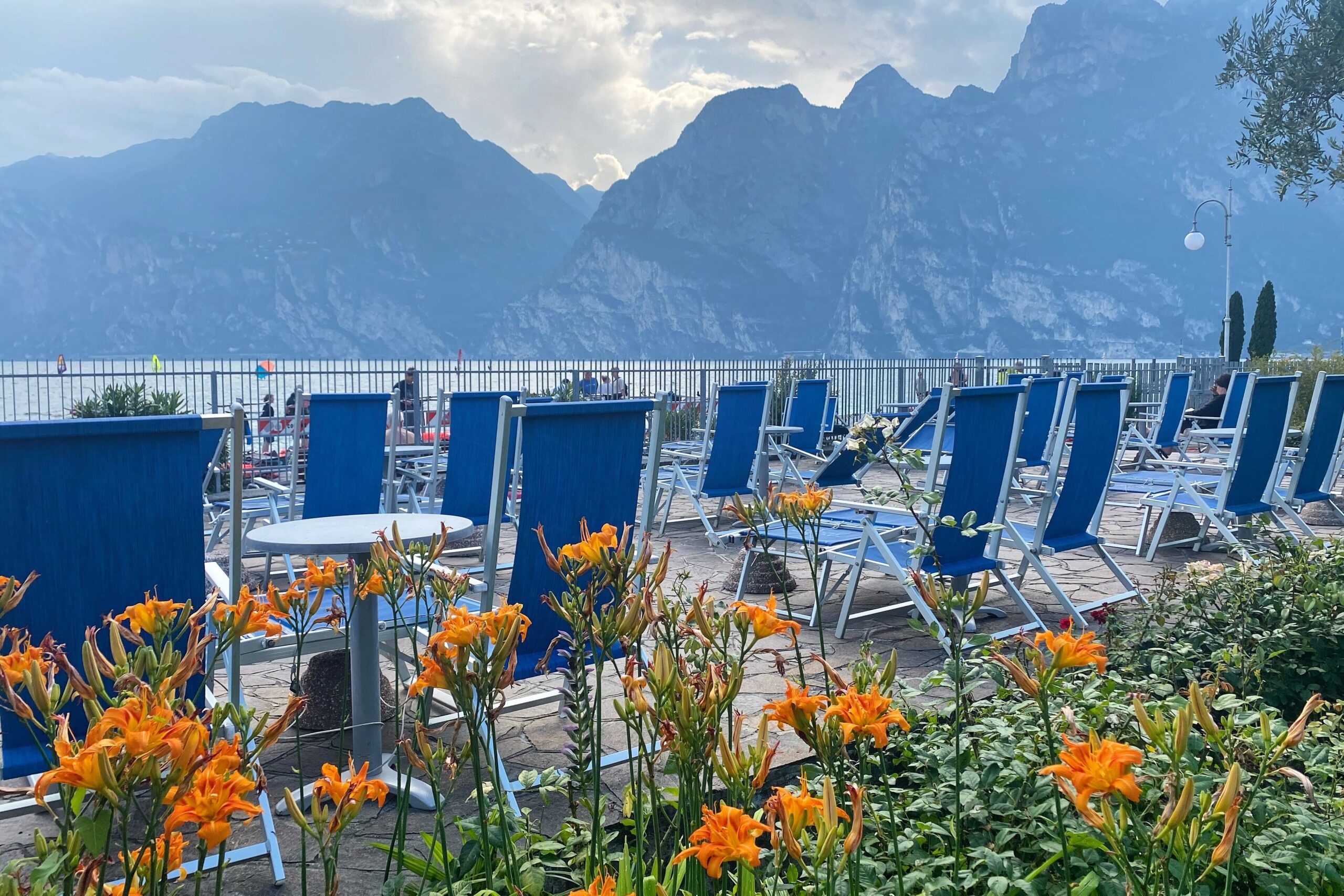 Lakeside terrace with reserved sun loungers for each apartment