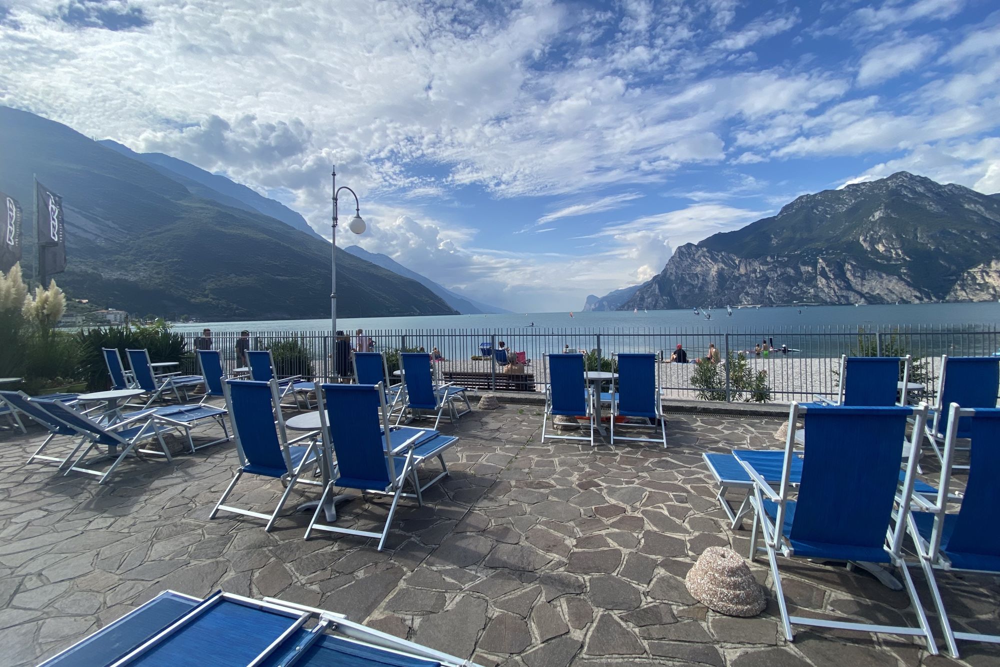 Lake-view terrace with sun loungers for each apartment