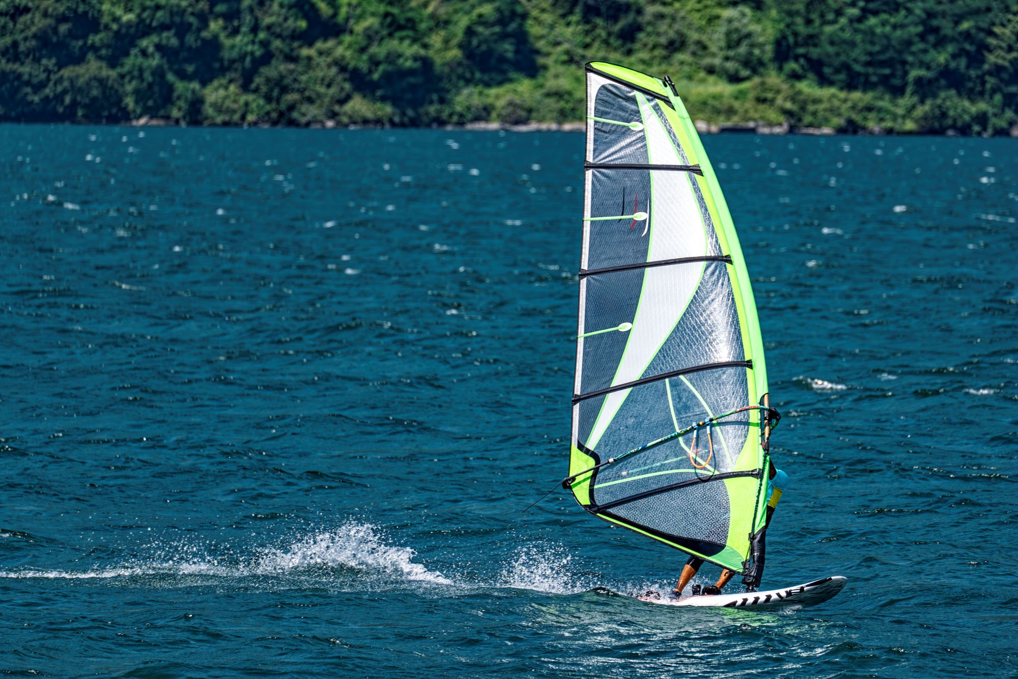 Incredible windsurfing scene on Lake Garda in Torbole, a paradise for water sports enthusiasts